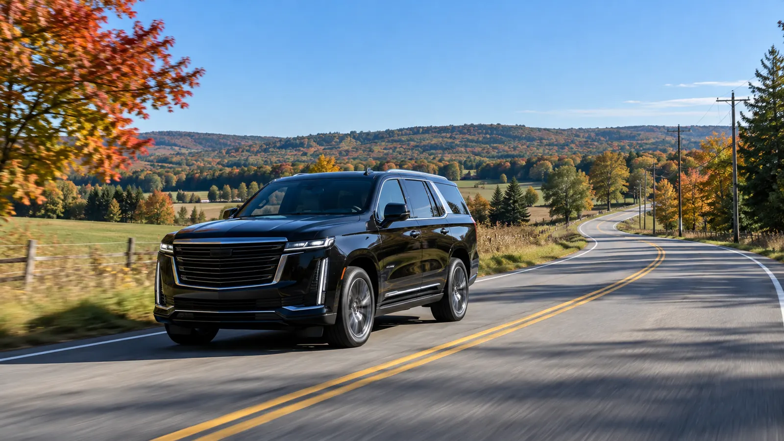 Illustration of a black transfer vehicle on a rural Ontario-style road in autumn